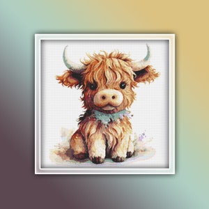 May include: A cross-stitch image of a Highland cow. The cow has shaggy, light brown fur, large eyes, and curved horns. It wears a blue scarf with floral accents. The artwork is framed in a white square.