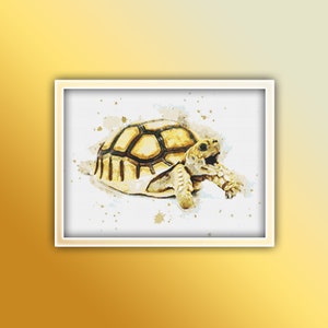 May include: A watercolor painting of a small tortoise with a yellow and brown shell. The tortoise is walking on a white background with brown watercolor splatters.