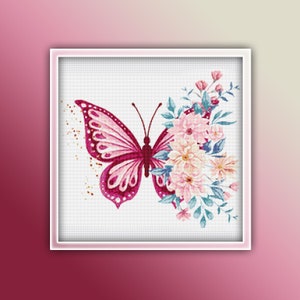 May include: Cross-stitch design featuring a butterfly with one wing detailed in pink and magenta, the other half adorned with a bouquet of pink and cream flowers and blue leaves. The artwork is framed in a white square.