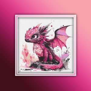 May include: A cross-stitch pattern featuring a baby dragon in pink and red hues. The dragon has large eyes and wings, and is seated on a rock. The background includes flames and watercolour-style splashes.
