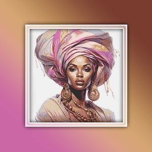 Può includere: Un ritratto di una donna con la pelle scura che indossa un turbante rosa e bianco, grandi orecchini d'oro e una collana d'oro. Sta guardando direttamente lo spettatore.