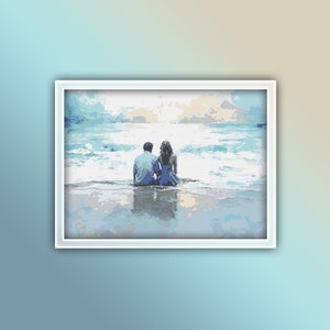 May include: A painting of a couple sitting on a beach, looking out at the ocean. The sky is a light blue and the water is a turquoise blue. The couple is wearing blue clothing.