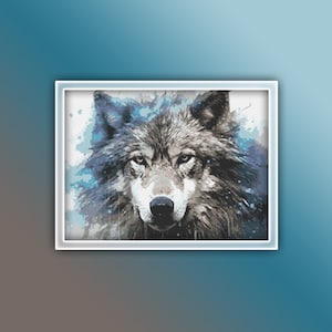 May include: A framed cross-stitch artwork featuring a detailed portrait of a wolf. The wolf's fur is rendered in shades of gray and brown, with blue accents. The artwork is set against a gradient background of blue and brown.