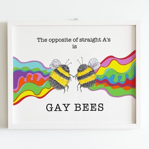 May include: A white framed print with the text "The opposite of straight A's is GAY BEES" and two cartoon bees facing each other with rainbow colored waves behind them.