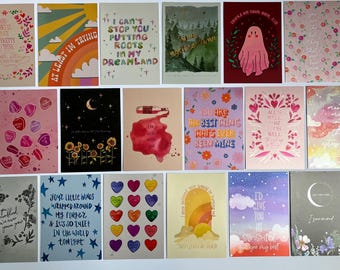 May include: A collection of various art prints with inspirational quotes and illustrations. The prints feature designs with hearts, flowers, rainbows, and celestial elements. Some prints include phrases like "I can't stop you putting roots in my dreamland."