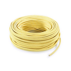 May include: A close-up of a yellow and white braided electrical cord wound into a coil.