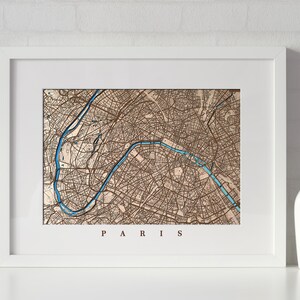 Carte en bois luminescente personnalisée. Gravure sur bois de la ville avec l'icône de la lumière. Carte découpée au laser de Paris.