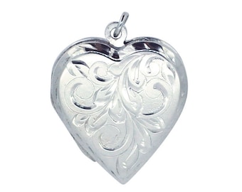 May include: A silver heart-shaped locket with an intricate floral design.