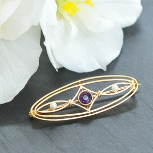 Broche met amethist en parel