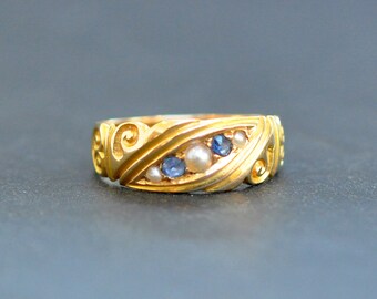 18kt zigeunerring met parel en saffier