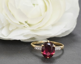 Anello con granato e diamanti