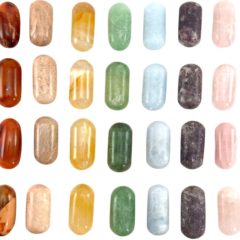 May include: A set of 24 tumbled stones in various colours, including red, orange, yellow, green, blue, purple, and pink. The stones are arranged in a grid pattern on a white background.