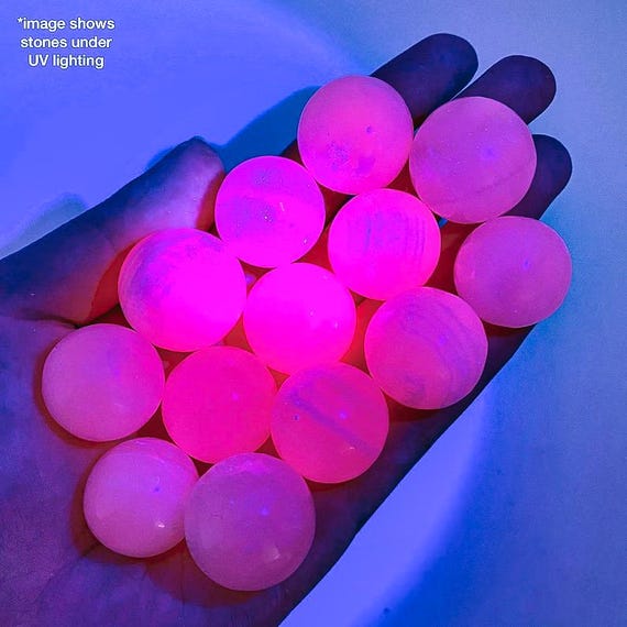 Mangano Calcite Sphere | UV reactive crystal ball, pink fluorescent polished orb