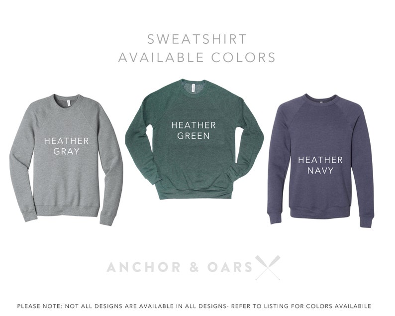 May include: Three sweatshirts in different colors: heather gray, heather green, and heather navy. The text "SWEATSHIRT AVAILABLE COLORS" is at the top of the image. The text "ANCHOR & OARS" is at the bottom of the image.