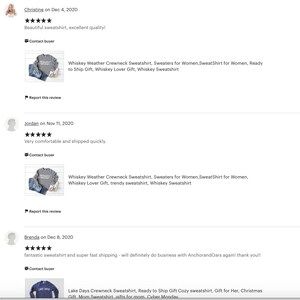 May include: Screenshot of Etsy product reviews. The reviews include text and images of sweatshirts. One image shows a gray crewneck sweatshirt with the text "Whiskey Weather". Another image shows a blue sweatshirt with the text "Lake Days".
