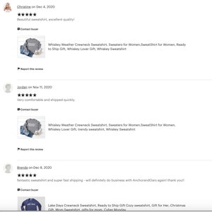 May include: Three customer reviews for a gray sweatshirt with the text "Whiskey Weather Crewneck Sweatshirt" on the front. The reviews are positive and mention the sweatshirt's quality, comfort, and fast shipping.