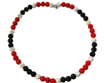 May include: A black, red and silver beaded necklace with a clasp fastening.