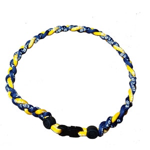May include: A blue and yellow braided lanyard with a black clasp. The lanyard has the words "Sports" and "Team" printed on it.