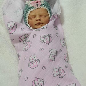 Mini dolls 13" and under pink kitty in a tea cup print double gauze swaddle,mini teddy bear.Reborn dolls, silicone dolls. No dolls included.