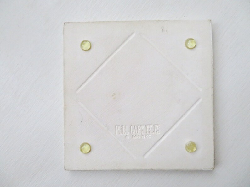 minimalist white kitchen decor white tile trivet with eggplants ceramic hot pad Pull Cart Tile vintage 90s
