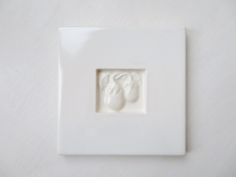 minimalist white kitchen decor white tile trivet with eggplants ceramic hot pad Pull Cart Tile vintage 90s