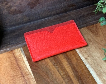 Credit card holder made of dark red leather. Smallest wallet ever.