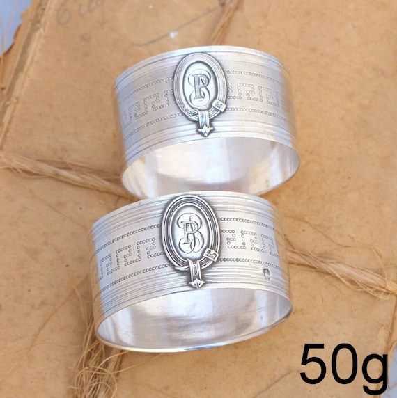 Pair of antique French sterling silver napkin rings in a highly guilloche cartouche style
