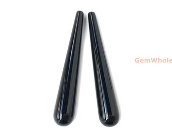 May include: Two black, polished, teardrop-shaped gemstone pendants.