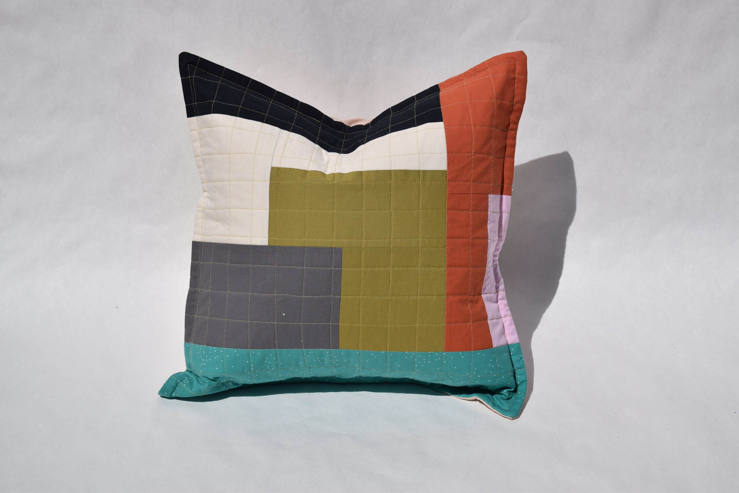 gray and rust pillows