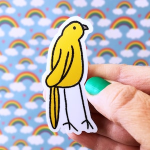May include: A yellow bird sticker with black outlines and legs. The sticker is on a white background with a rainbow pattern.