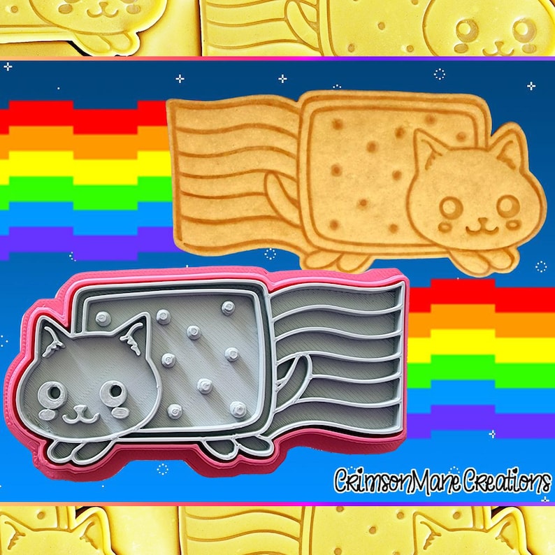 May include: Cookie cutters in the shape of a cat riding a rectangular cookie. The cat is light brown and the cookie is tan. A gray and pink cookie cutter is also shown. The background is blue with a rainbow.