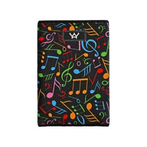 May include: Black fabric phone case with a colorful musical note pattern. The case has a small white logo with the letters "WY" in the center.