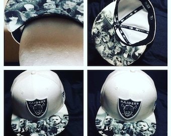Oakland Raiders Authentic New Era Snapback or Fitted Cap with Villians Image on Top and Bottom