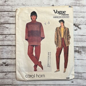 May include: Vintage Vogue Patterns sewing pattern for a jacket and pants. The pattern is for size 10 and is by designer Carol Horn. The pattern is for a jacket with a collar and long sleeves and pants with a straight leg. The pattern is printed on white paper with black text and illustrations.