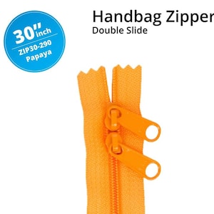 May include: A 30-inch Papaya orange handbag zipper with a double slide. The zipper is a bright orange color and features two pull tabs. The product name and measurements are displayed in a blue circle.