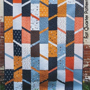 May include: A colorful quilt pattern titled "Elvira" with a patchwork design. The quilt features squares in navy, orange, white, and blue, with diagonal accents. The quilt measures 63" x 84". The pattern is by GE Designs.