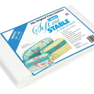 May include: White Soft and Stable foam stabilizer by Annie's, 18" x 58" (45.7 cm x 147 cm). The product is designed for bags and beyond. The packaging features examples of finished projects.