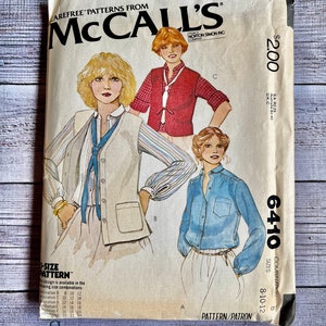 May include: A vintage McCall's sewing pattern for a blouse and vest. The pattern is for sizes 8-10-12 and is priced at $2.00. The pattern number is 6410.