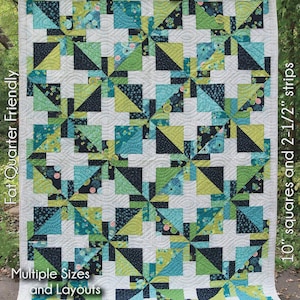 May include: A colorful quilt with a geometric pattern in shades of teal, green, and navy blue. The quilt features a repeating design of squares and triangles, with the word "June" in large white letters. The quilt measures 74" x 100".