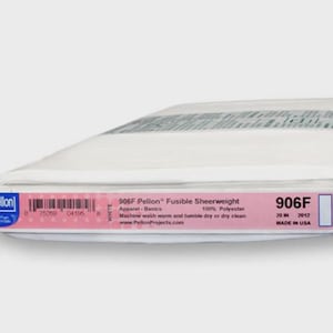 May include: A roll of white Pellon 906F Fusible Sheerweight fabric, 20 inches wide, for apparel basics. The label includes the brand name, product details, and care instructions. Made in the USA.