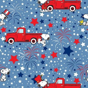 May include: A blue background with red, white, and blue stars, fireworks, and red pickup trucks.  Snoopy is featured in various poses, including driving the truck, playing a drum, and holding a flag.