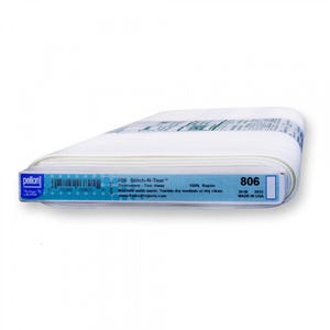 May include: A roll of white Pellon 806 Stitch-N-Tear embroidery fabric. The label indicates it is 20 inches wide and made of 100% rayon. The label also includes instructions for machine washing and drying.