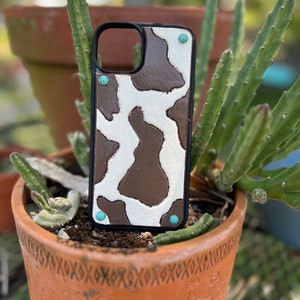 iPhone 14 Plus tooled leather western phone case cow print and turquoise
