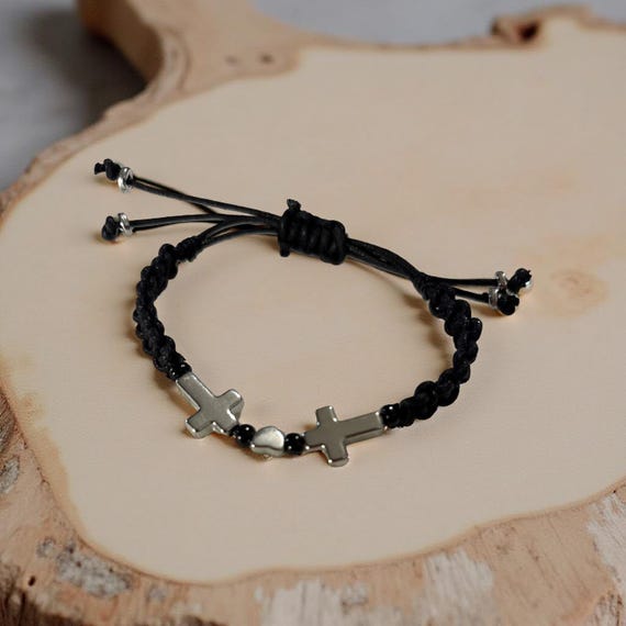 Handmade Breaded bracelet adjustable with two silver cross and black beads. It is made with strong Chinese waxed cord. Simple and elegant.