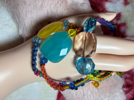 Three colorful braided bracelet. Selling individually made with glass beads and Aurifil floss thread. Bracelets adjustable up to 10 inches.