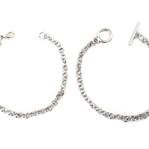 May include: Two silver chain bracelets, one with a t-bar clasp and the other with a lobster claw clasp.