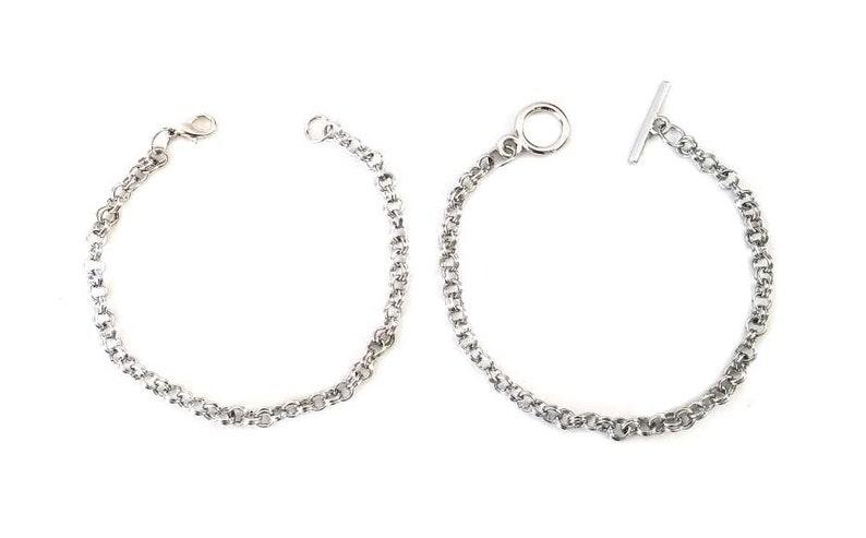 May include: Two silver chain bracelets, one with a t-bar clasp and the other with a lobster claw clasp.