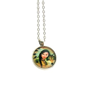 May include: Silver necklace with a round pendant featuring a colorful image of a Native American woman with a wolf.