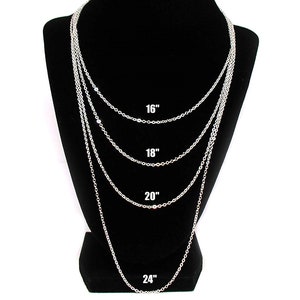 May include: Four silver chains of different lengths displayed on a black mannequin. The chains are 16 inches, 18 inches, 20 inches, and 24 inches long.