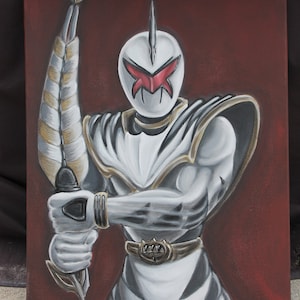 May include: A hand-painted canvas depicting a white Power Ranger with a red visor and a gold belt. The Ranger is holding a silver sword with a gold handle. The background is a dark red.
